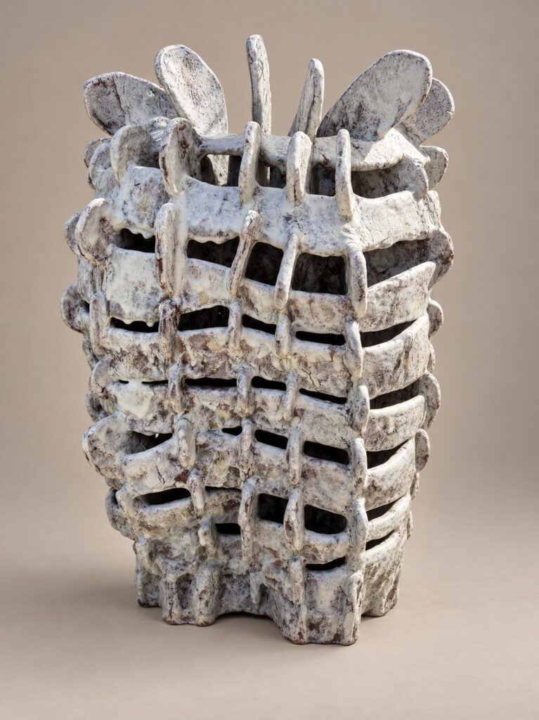 Tall white woven lattice vessel. Ceramic sculpture by Ted Fullwood